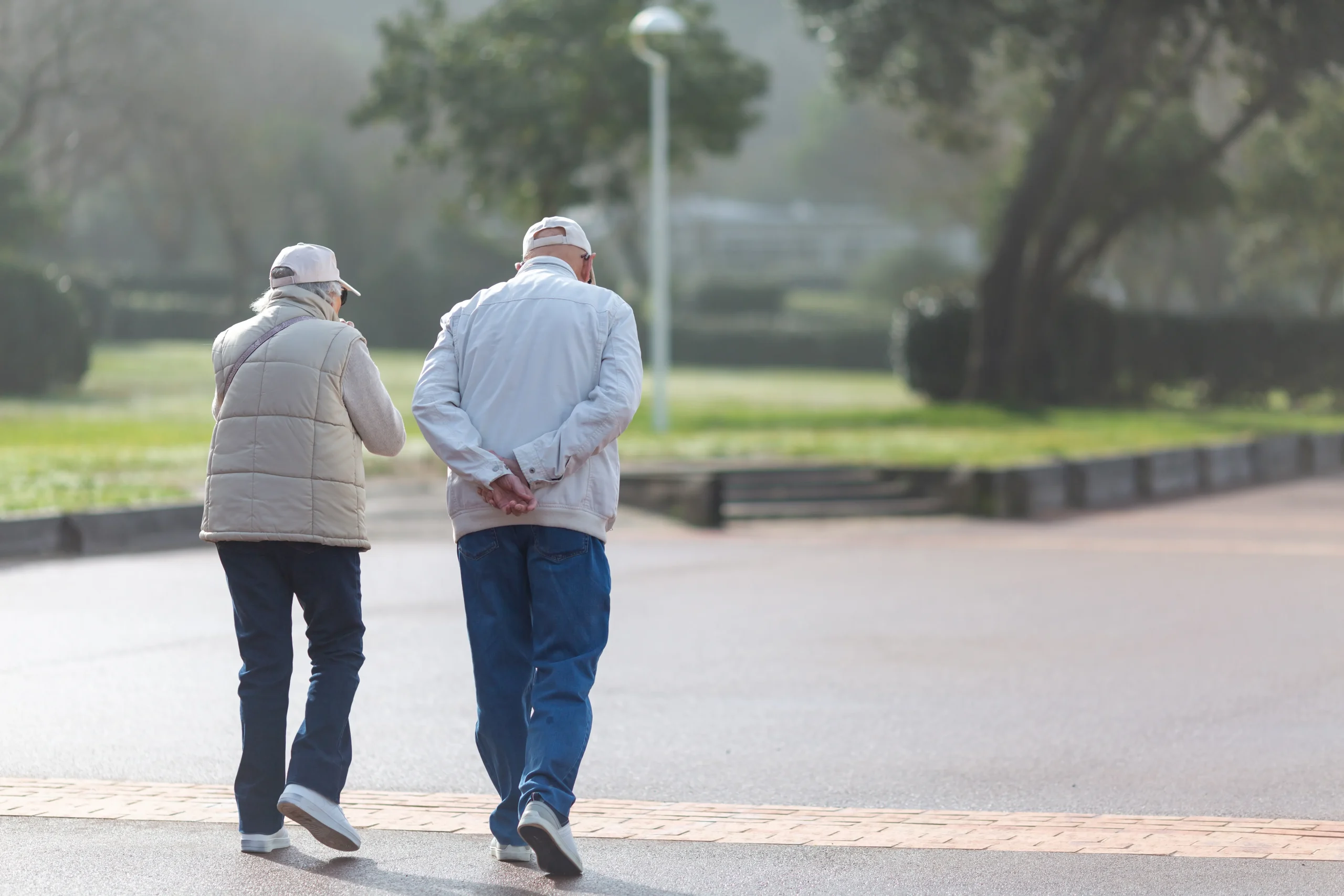 49795074 couple walking on the promenade on a sunny day