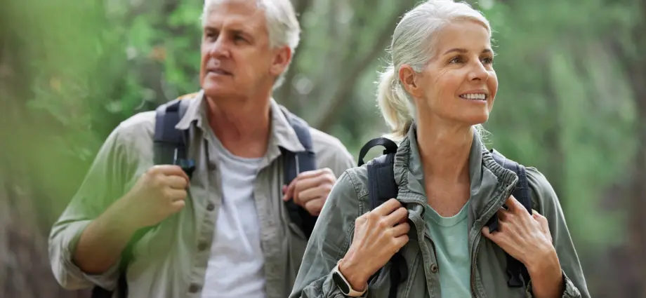 51140634 Elderly Couple Hiking and Active Seniors in a Forest Happy and Relax While Walking in Nature Senior Backpacker and Woma